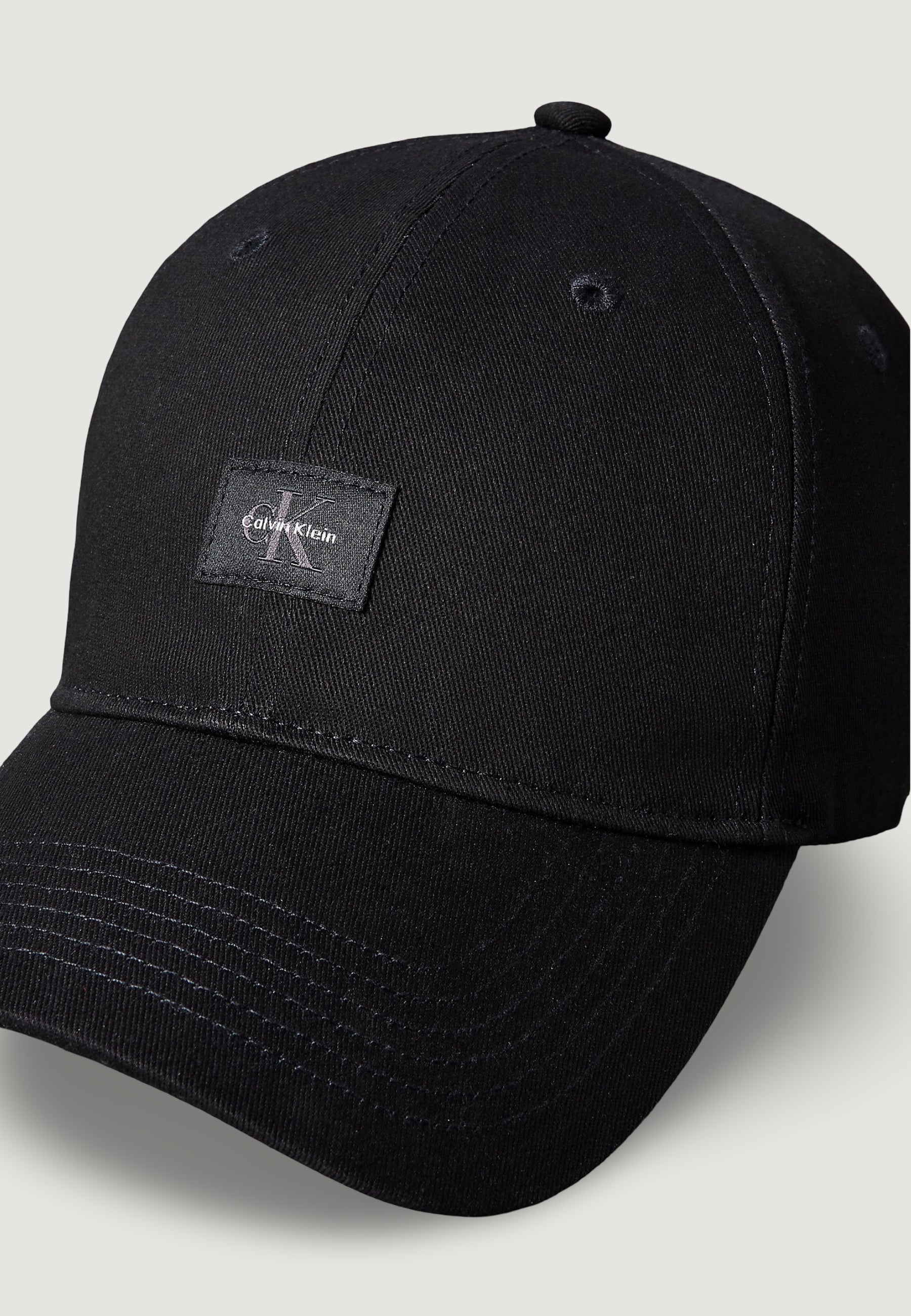 Cappello con visiera Calvin Klein MONOLOGO WOVEN PATCH BB