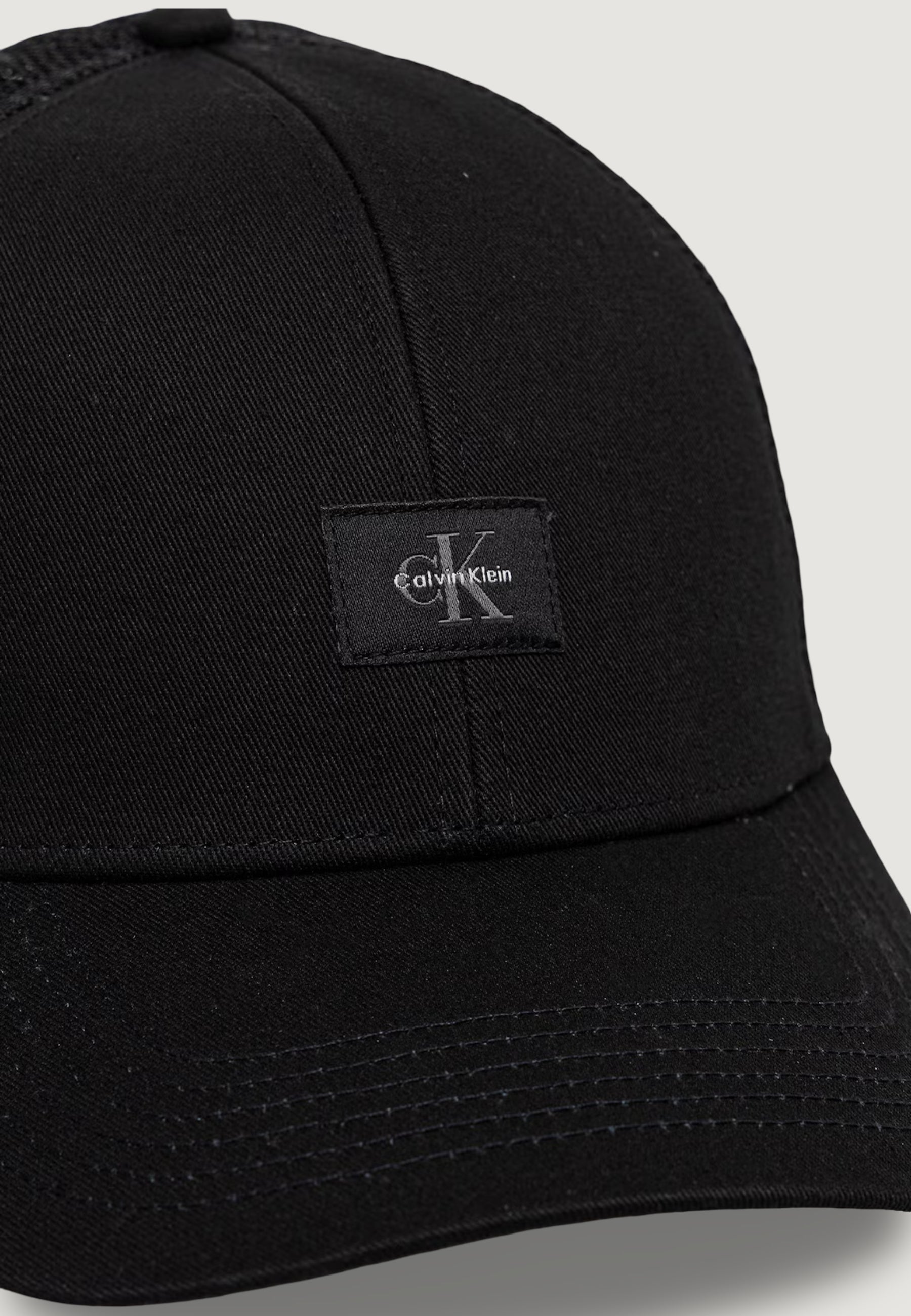 Cappello con visiera Calvin Klein MONOLOGO WOVEN PATCH TRUCKER