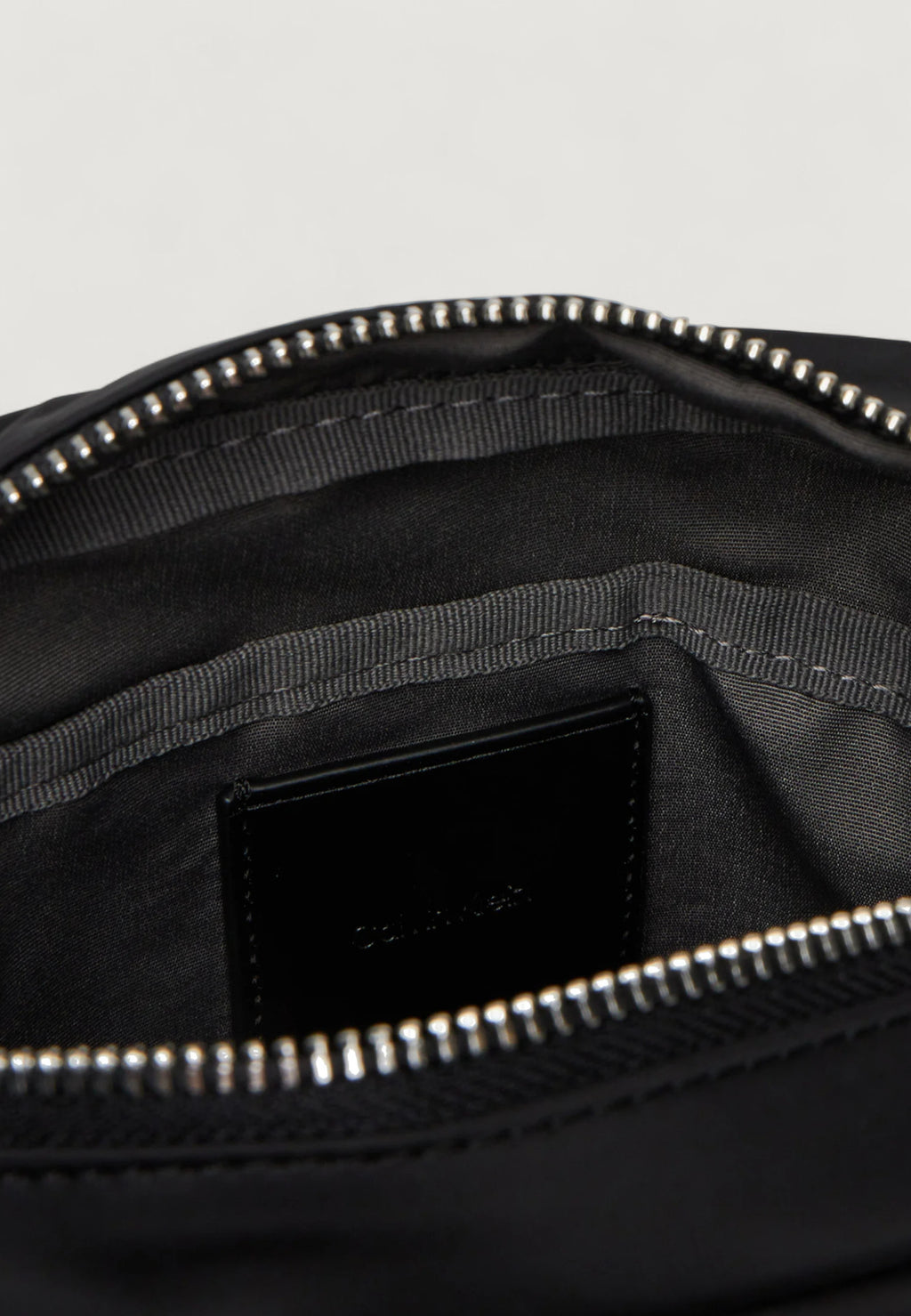 Sling bag Calvin Klein SLEEK NYLON REPORTER